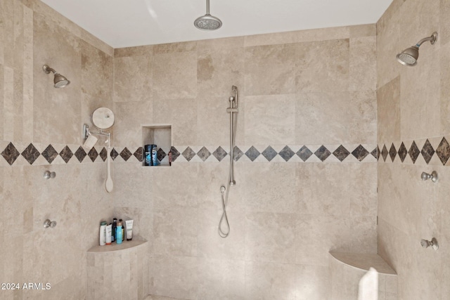 bathroom featuring tiled shower