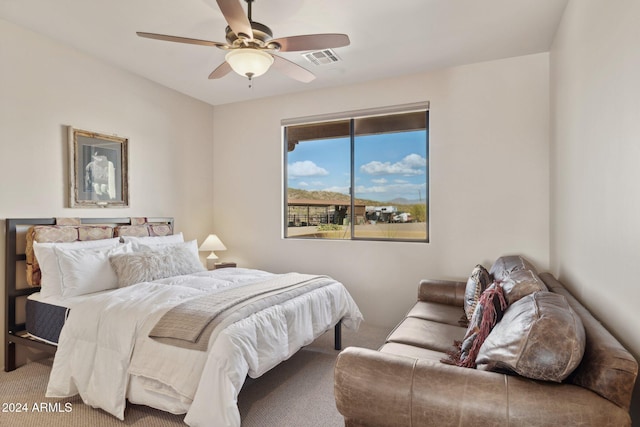 bedroom featuring ceiling fan and carpet floors