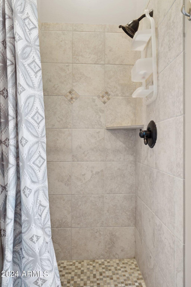 bathroom with curtained shower