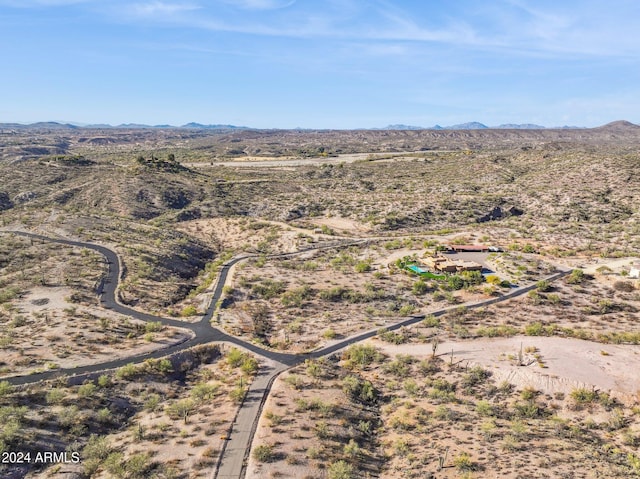 birds eye view of property with a mountain view