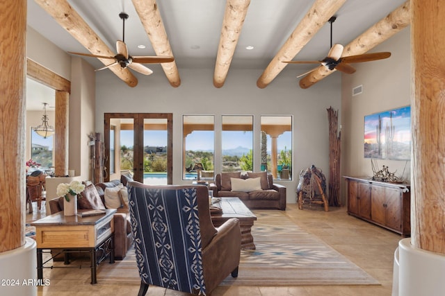 living room featuring beam ceiling, ceiling fan, and french doors