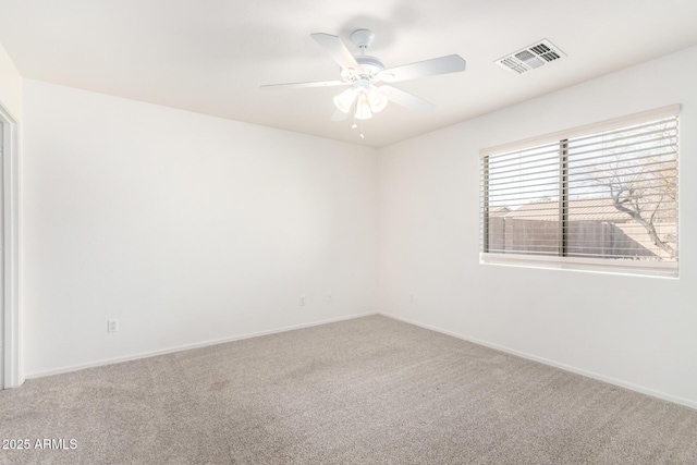 empty room featuring carpet and ceiling fan