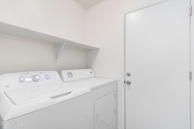 laundry room featuring separate washer and dryer