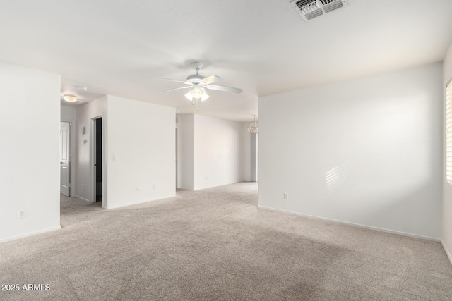 empty room featuring light colored carpet and ceiling fan