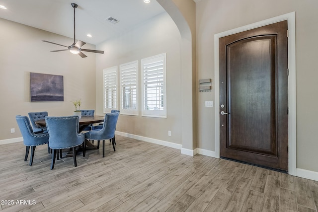 22255 E Quintero Rd, Queen Creek, AZ 85142 - dining space with arched walkways, light wood-type flooring, ceiling fan, baseboards, and recessed lighting