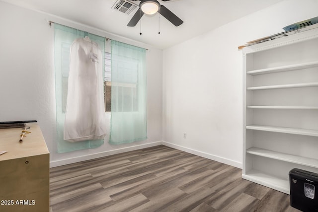 interior space with hardwood / wood-style floors and ceiling fan