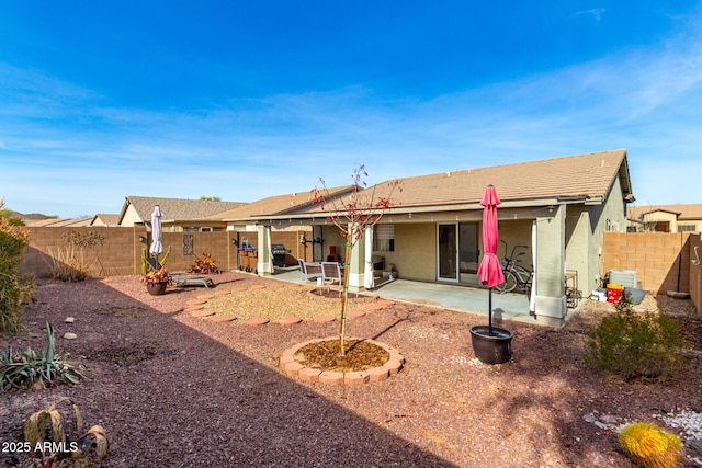 back of house with a patio area