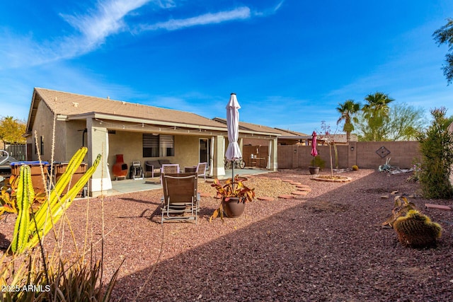 rear view of property featuring a patio area