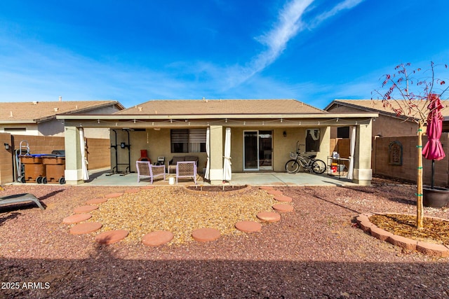 back of property with a patio