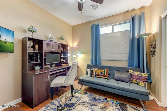 office featuring hardwood / wood-style floors and ceiling fan