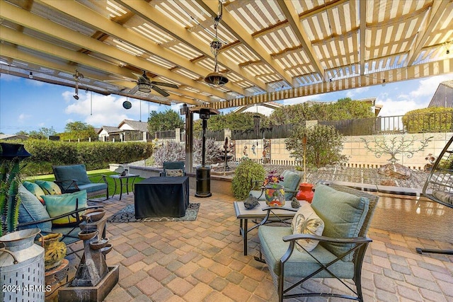 view of patio / terrace featuring a pergola, ceiling fan, and an outdoor hangout area