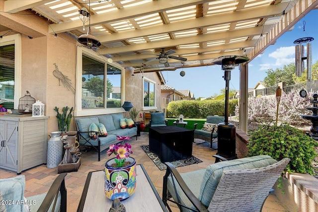 view of patio featuring an outdoor hangout area, ceiling fan, and a pergola