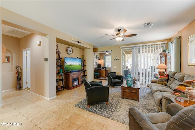 tiled living room with ceiling fan