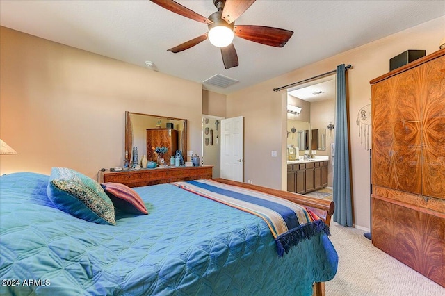 carpeted bedroom with ceiling fan and connected bathroom