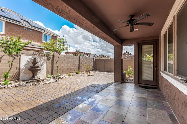 view of patio featuring ceiling fan