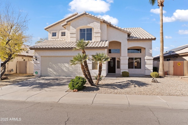 mediterranean / spanish house featuring a garage