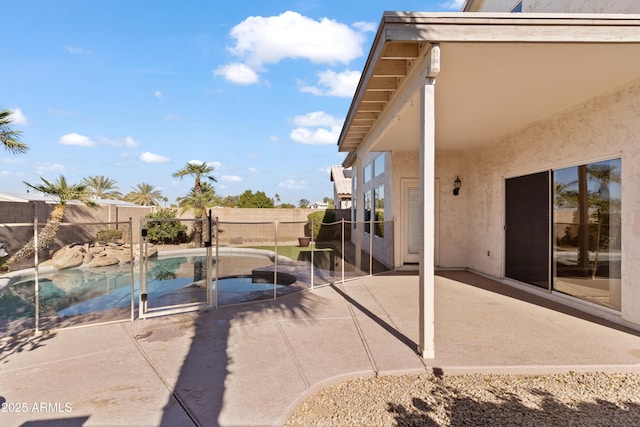 view of patio / terrace with a fenced in pool