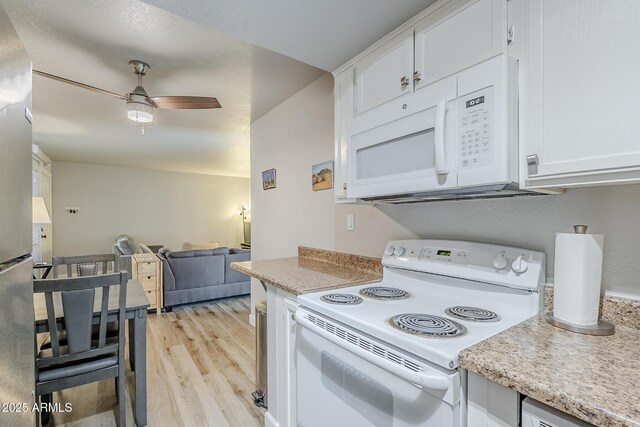 17 E Ruth Ave Unit 303, Phoenix, AZ 85020 - kitchen featuring white appliances, a ceiling fan, light wood-style flooring, and light countertops