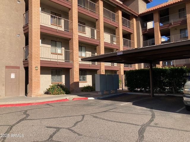 17 E Ruth Ave Unit 303, Phoenix, AZ 85020 - view of apartment building / complex featuring covered parking