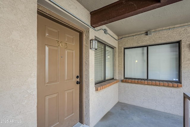 17 E Ruth Ave Unit 303, Phoenix, AZ 85020 - doorway to property featuring stucco siding