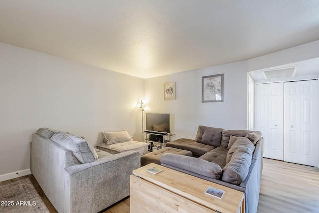 17 E Ruth Ave Unit 303, Phoenix, AZ 85020 - living area with light wood finished floors and baseboards