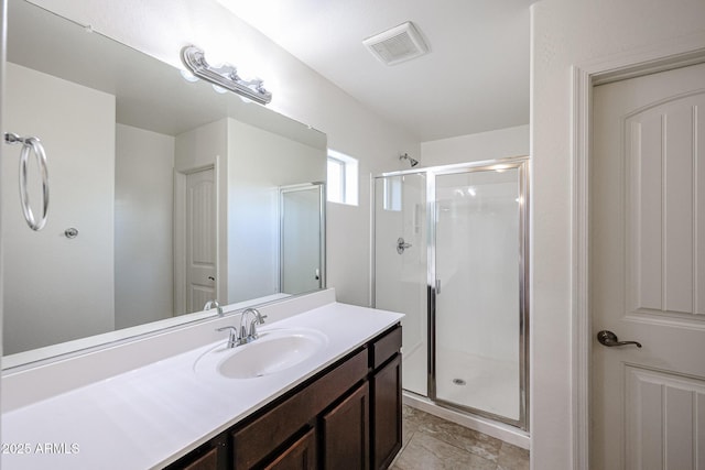 bathroom with vanity and walk in shower