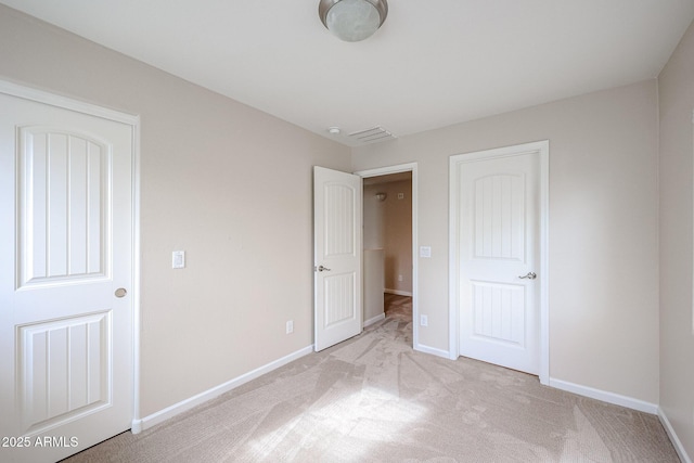 unfurnished bedroom with light carpet