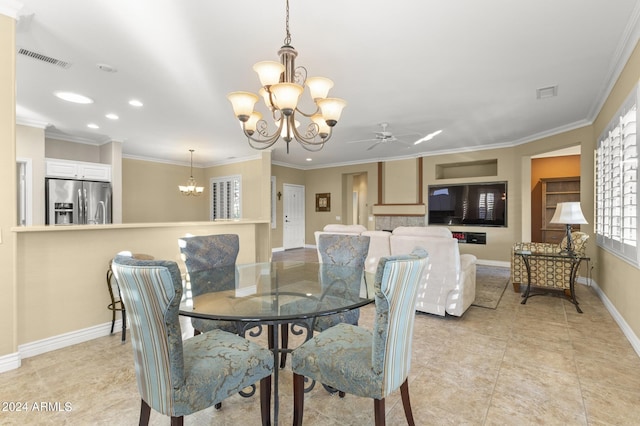 dining area featuring ceiling fan with notable chandelier, crown molding, and light tile patterned floors