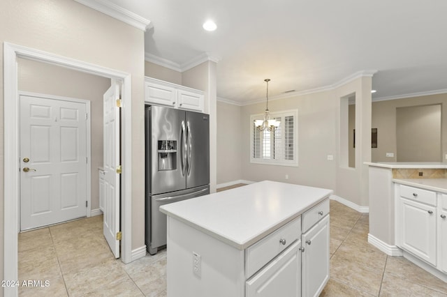 kitchen featuring a kitchen island, hanging light fixtures, white cabinetry, ornamental molding, and stainless steel refrigerator with ice dispenser