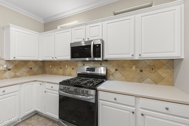 kitchen with stainless steel appliances and white cabinets