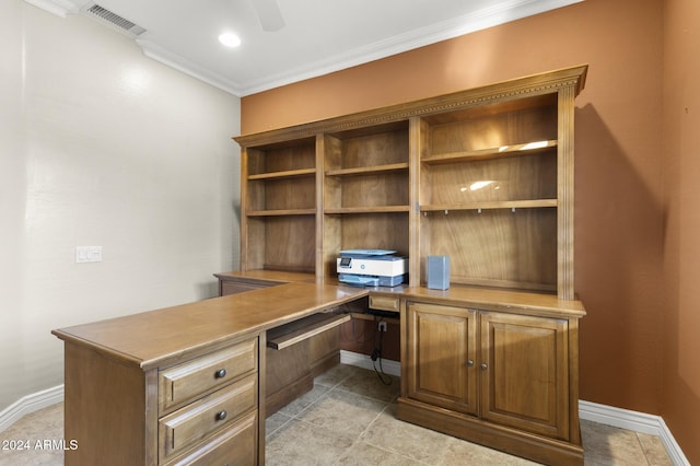 tiled office with crown molding and built in desk