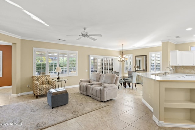 living room with light tile patterned flooring, ceiling fan with notable chandelier, and crown molding