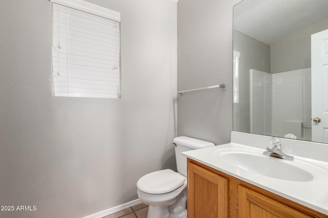 bathroom featuring vanity, toilet, and walk in shower