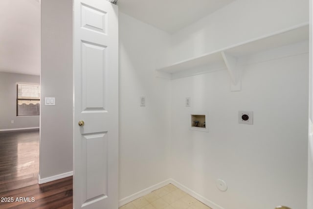 washroom with hookup for a gas dryer, wood-type flooring, hookup for a washing machine, and electric dryer hookup