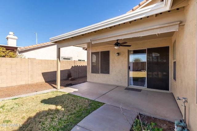 view of patio / terrace featuring ceiling fan