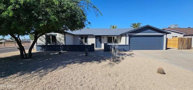 ranch-style house featuring a garage