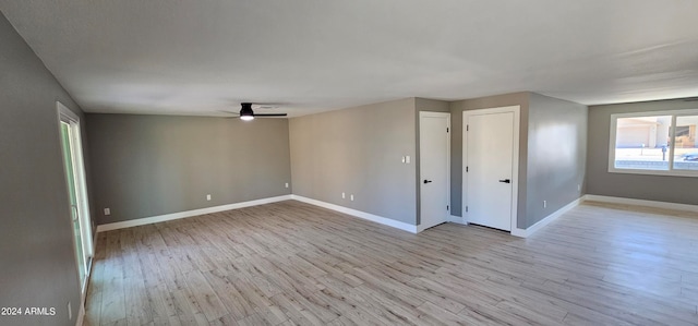 empty room featuring ceiling fan and light wood-type flooring