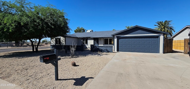 ranch-style house featuring a garage