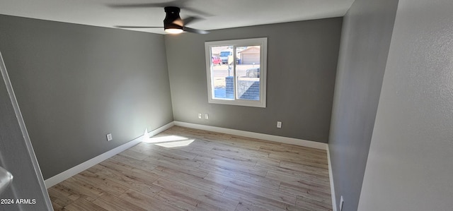 empty room featuring ceiling fan and light wood-type flooring