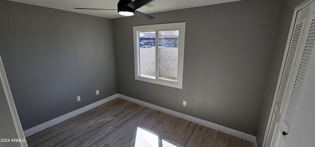 unfurnished bedroom with hardwood / wood-style flooring and ceiling fan