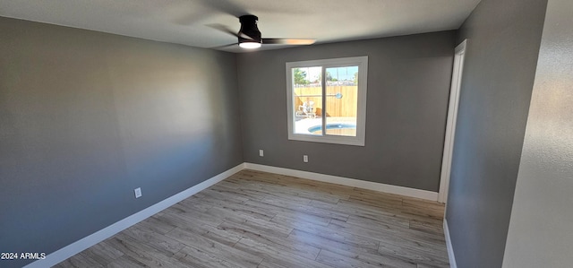 empty room featuring ceiling fan and light hardwood / wood-style floors