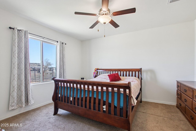 bedroom featuring ceiling fan and light carpet