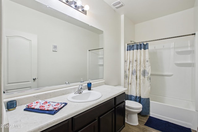 full bathroom with shower / tub combo with curtain, wood-type flooring, toilet, and vanity