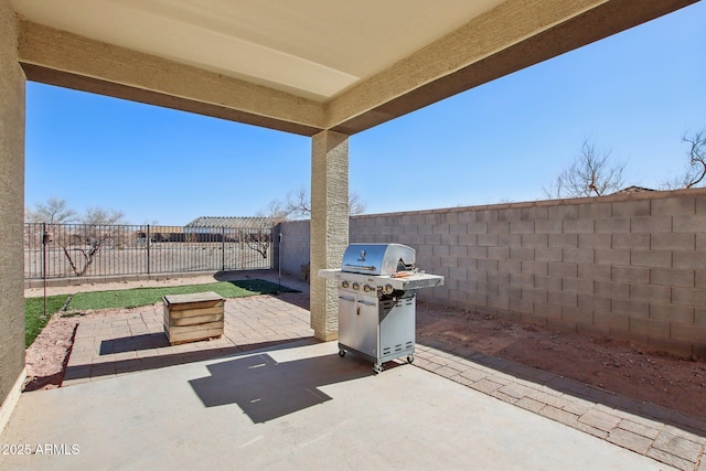 view of patio featuring a grill