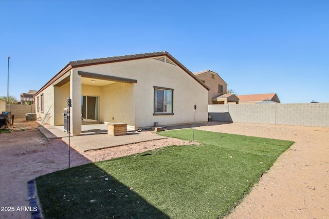 rear view of house featuring a patio area