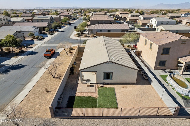 birds eye view of property with a mountain view