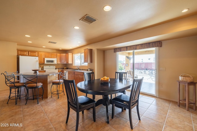 dining room featuring plenty of natural light, visible vents, and recessed lighting