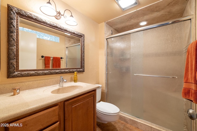 full bath featuring tile patterned flooring, toilet, visible vents, vanity, and a shower stall