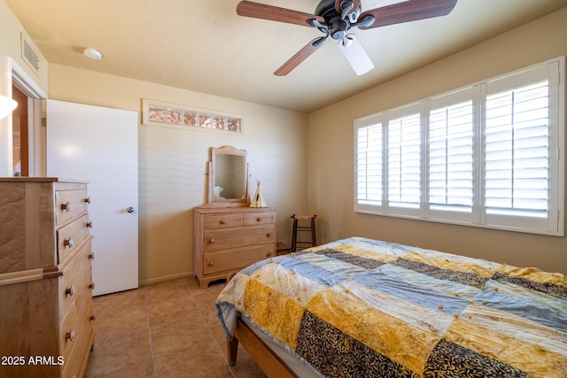 bedroom with ceiling fan, visible vents, and light tile patterned flooring