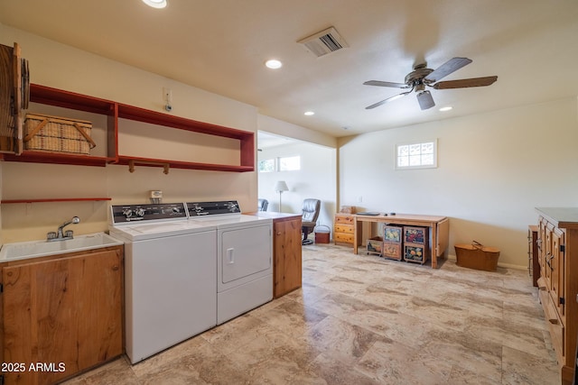 laundry area featuring ceiling fan, laundry area, a sink, visible vents, and independent washer and dryer